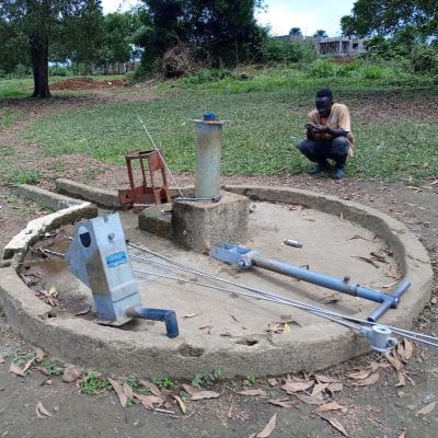 Community hand pump undergoing repairs 